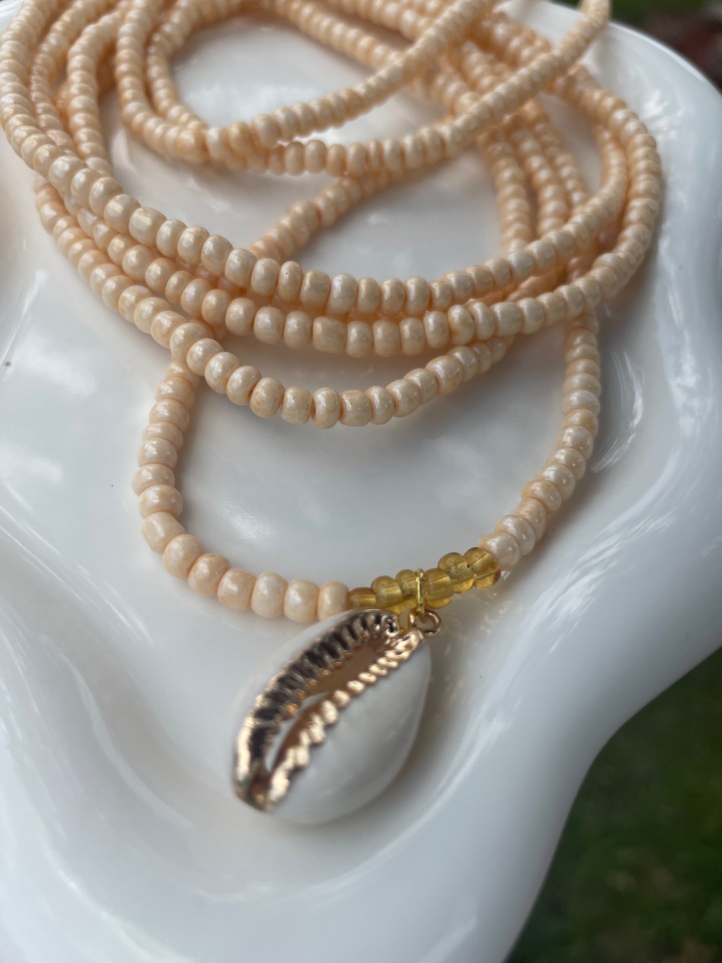 Cowrie shell charm waist beads.  Weight loss tracker cream colored traditional tie on belly beads