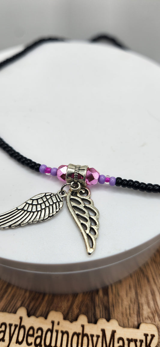 Protection and covered black waistbeads with angel 🪽 charm.