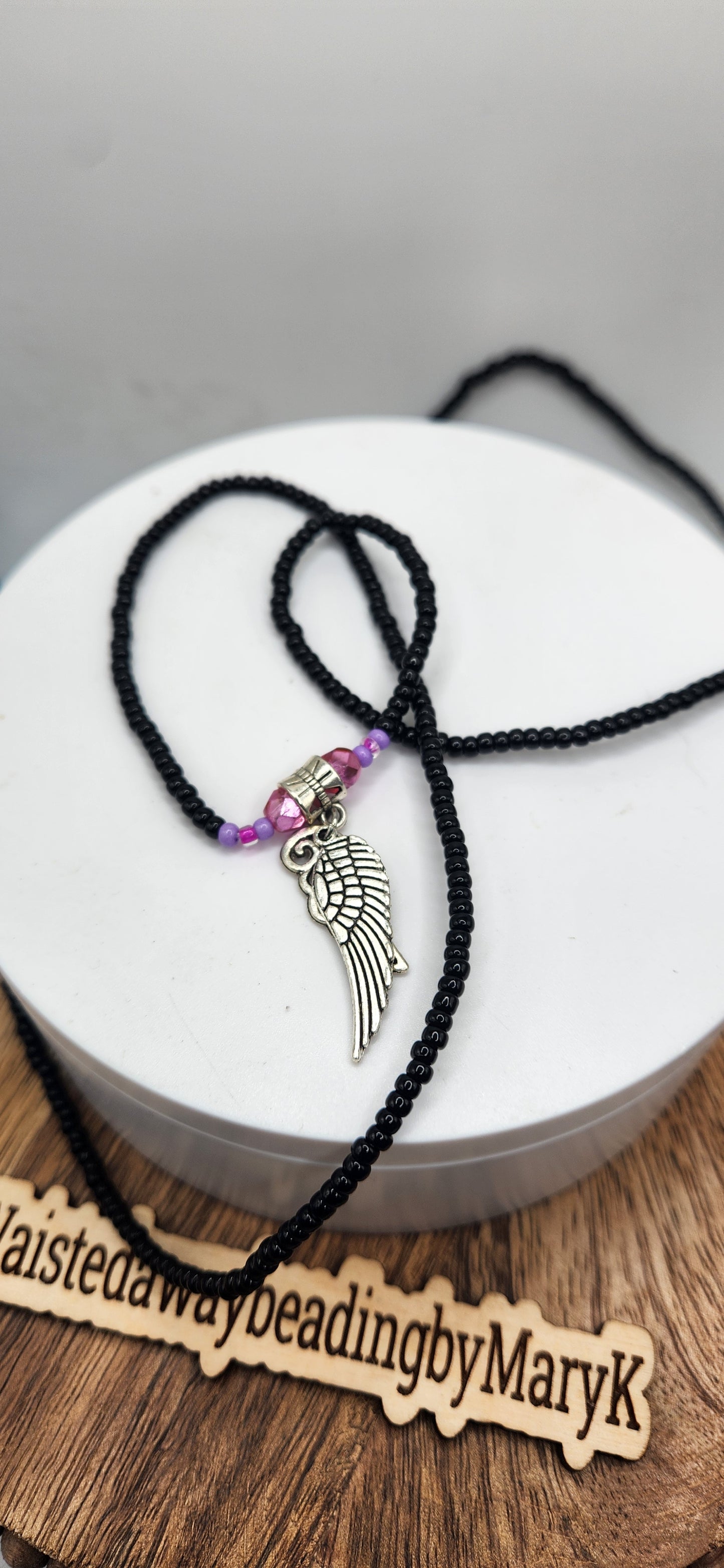 Protection and covered black waistbeads with angel 🪽 charm.