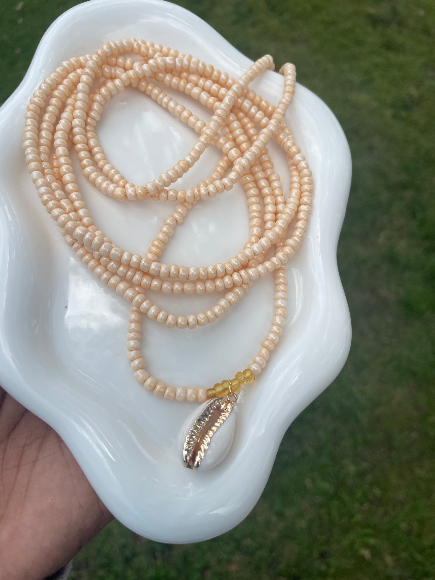 Cowrie shell charm waist beads.  Weight loss tracker cream colored traditional tie on belly beads