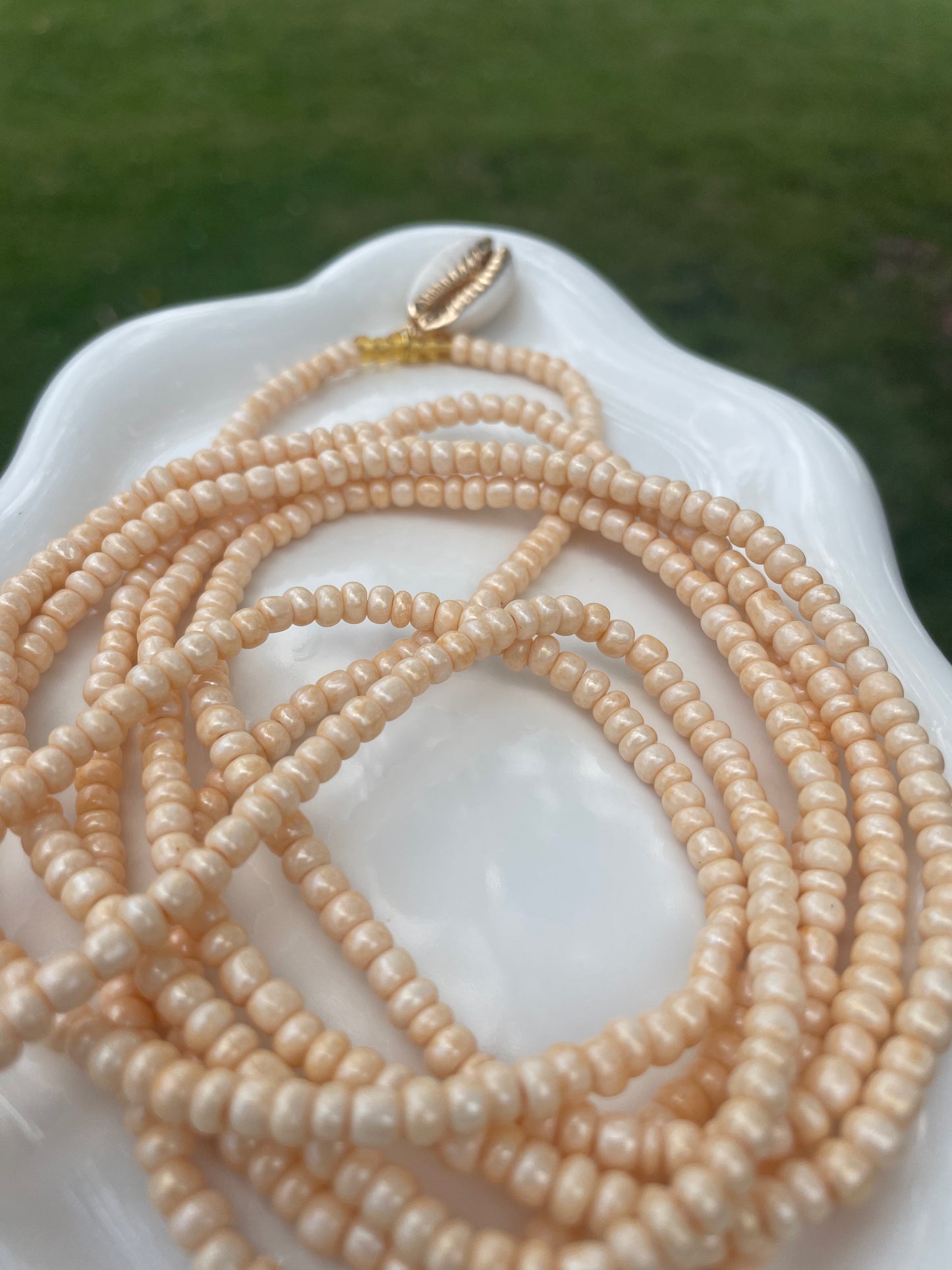 Cowrie shell charm waist beads.  Weight loss tracker cream colored traditional tie on belly beads