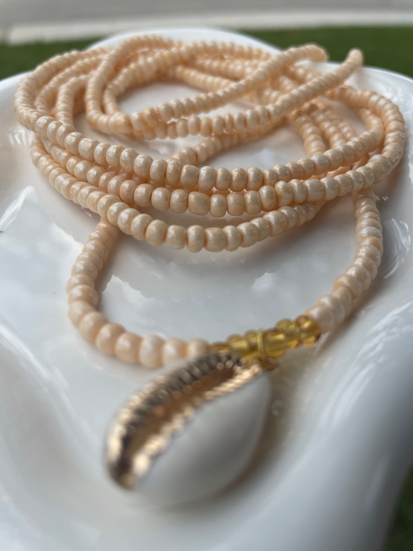 Cowrie shell charm waist beads.  Weight loss tracker cream colored traditional tie on belly beads