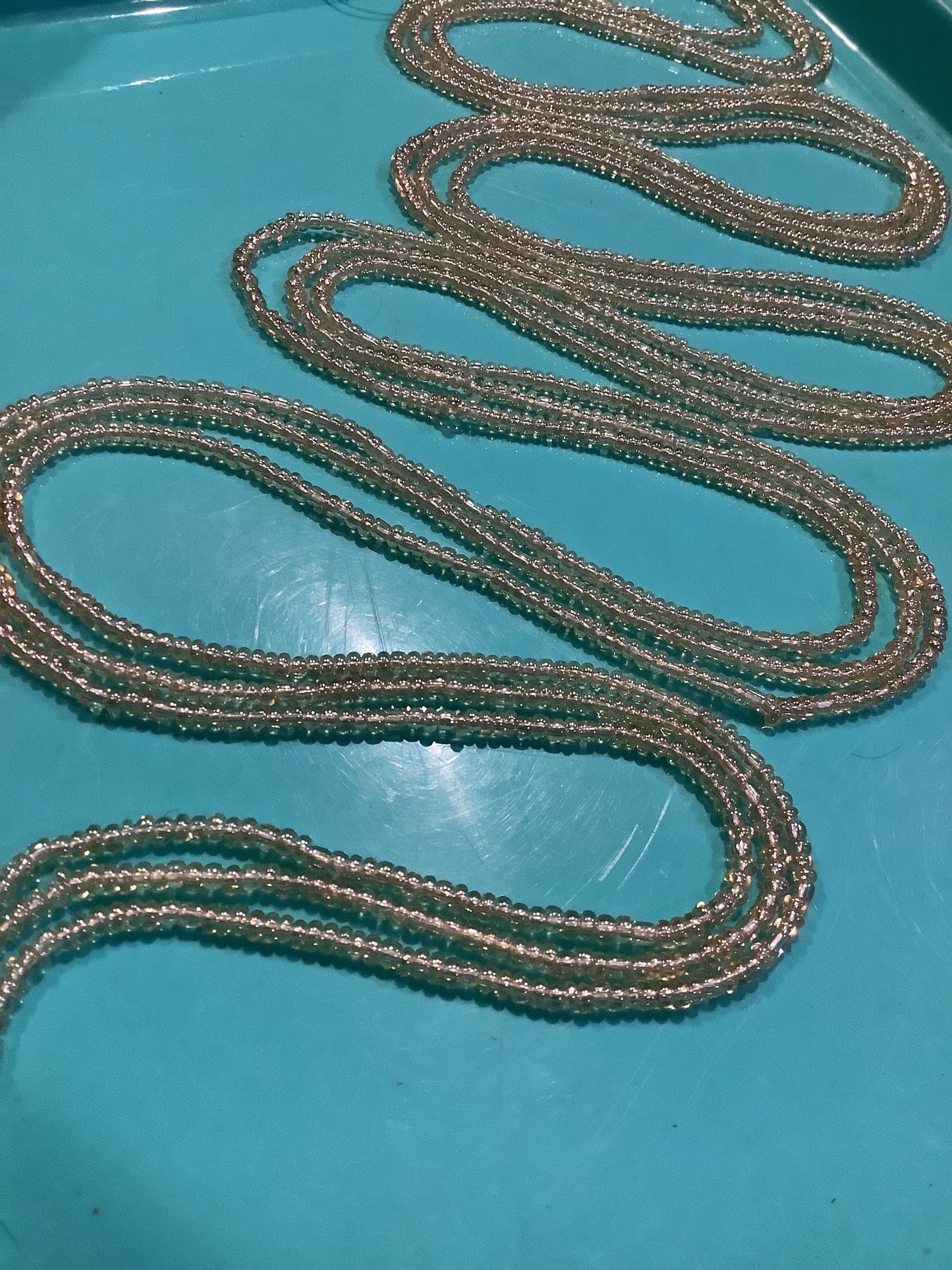 Golden Radiance: This name highlights the bright, warm color and the sparkling, faceted nature of the beads, which catch the light.