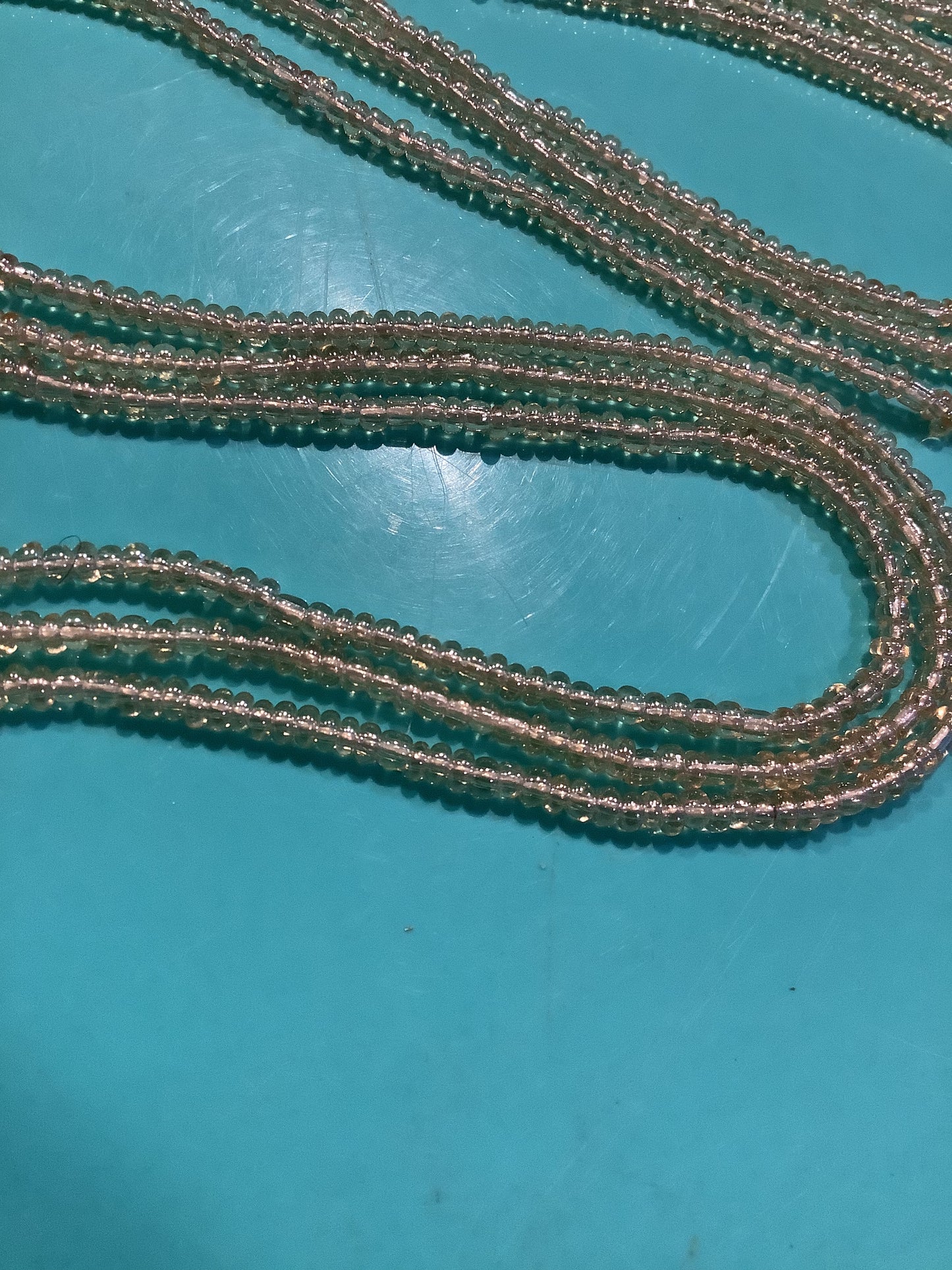 Golden Radiance: This name highlights the bright, warm color and the sparkling, faceted nature of the beads, which catch the light.