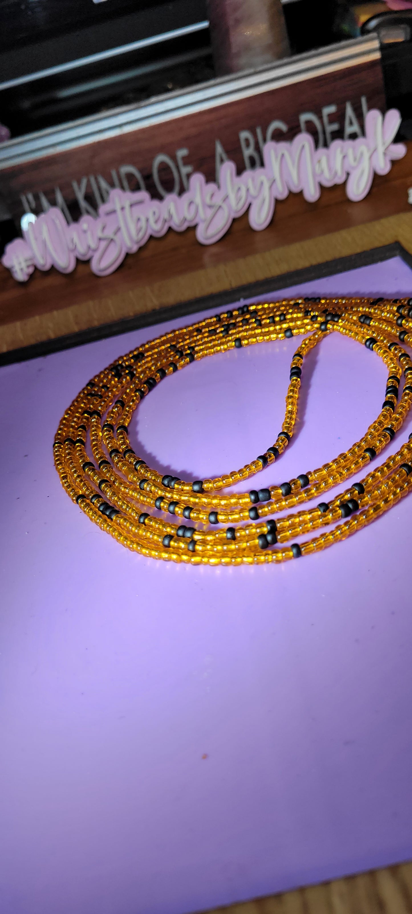 Orange and black traditional tie on body adornment.