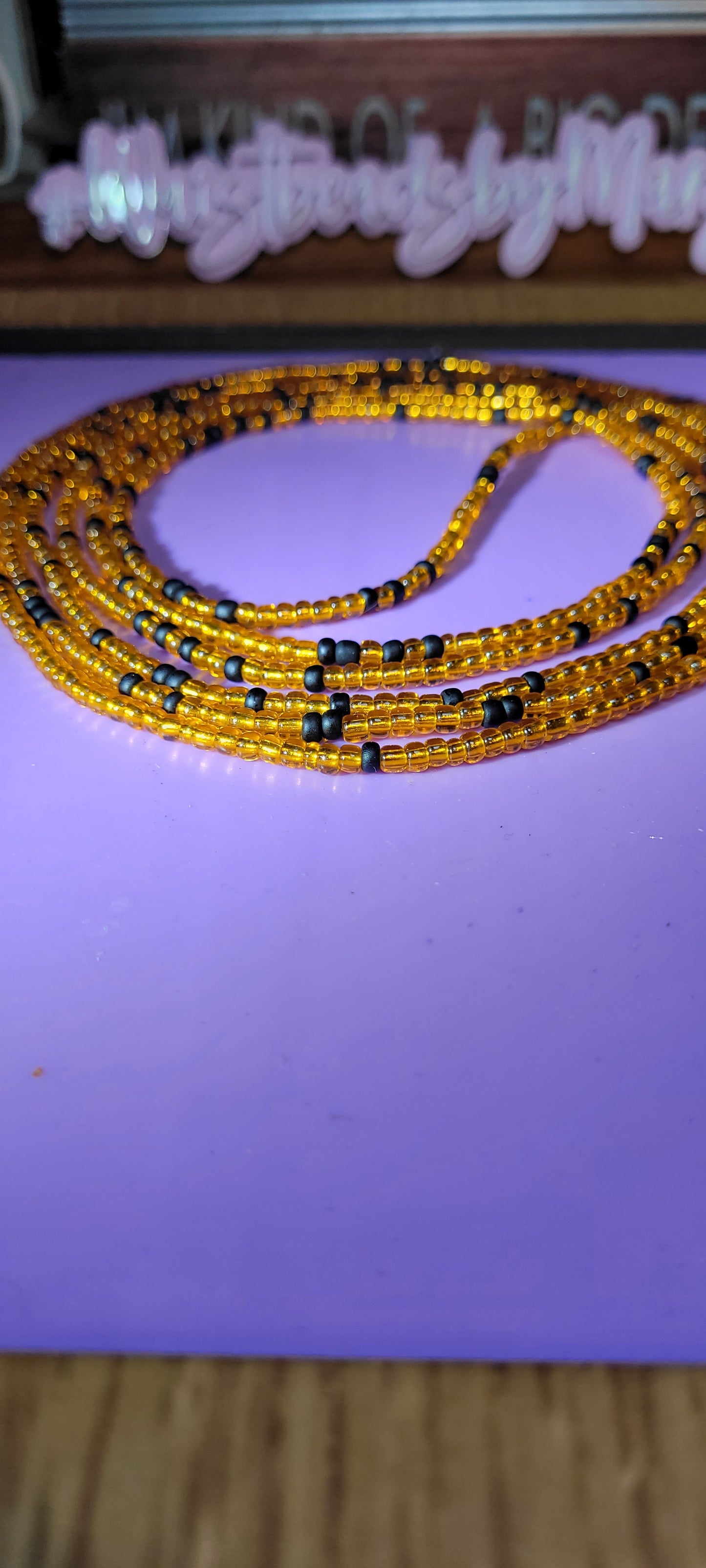 Orange and black traditional tie on body adornment.